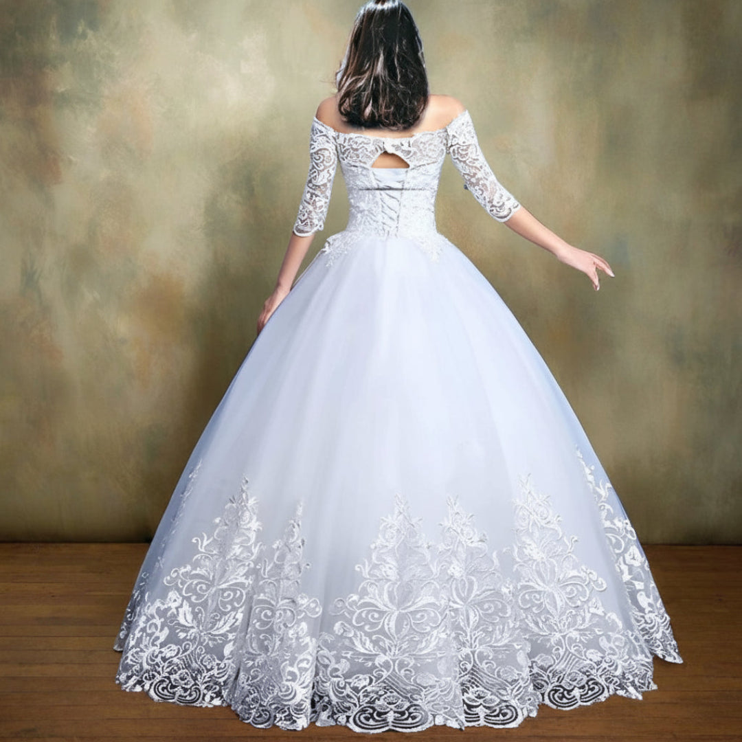 Full-length view of White Princess with Off Shoulder with train spread on floor — GownLink GLQD09