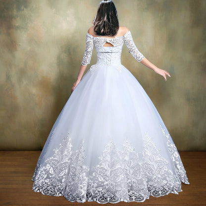 Full-length view of White Princess with Off Shoulder with train spread on floor — GownLink GLQD09