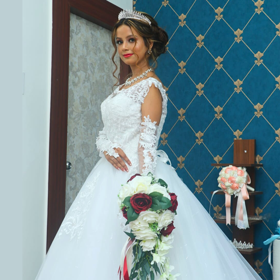 Romantic Christian bridal ball gown with intricate lace patterns and a dramatic princess silhouette