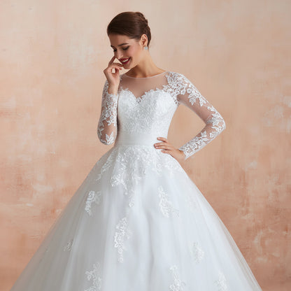 Romantic Christian church wedding dress with floral lace detailing and soft tulle layers
