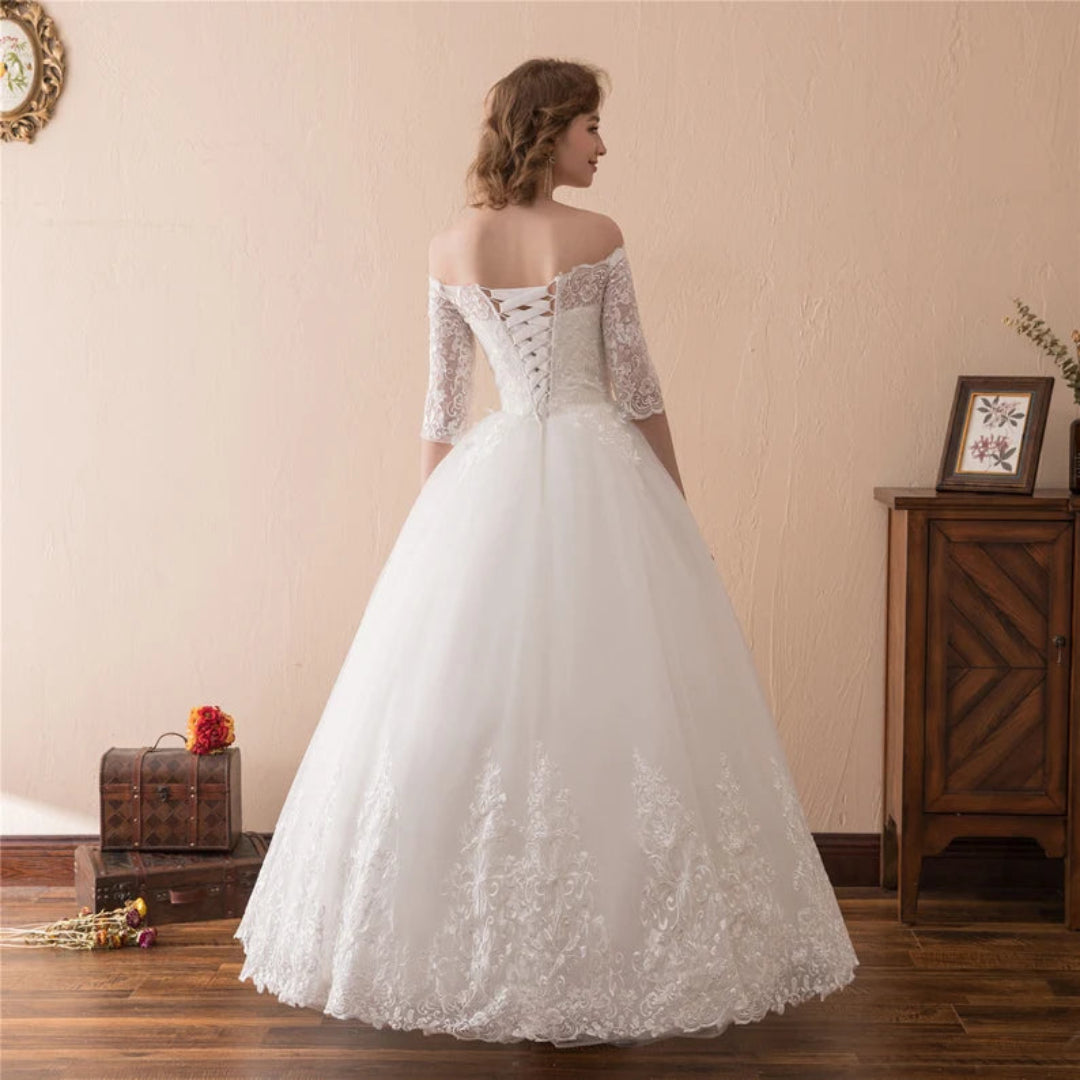 Romantic off-shoulder Christian wedding dress with elegant lace sleeves and timeless bridal style