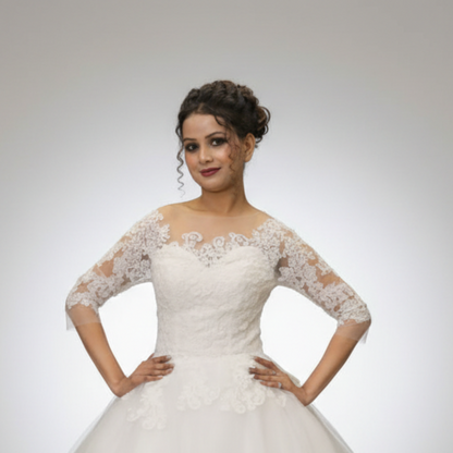 Classic Christian wedding ball gown with lace bodice, tulle skirt, and timeless bridal elegance
