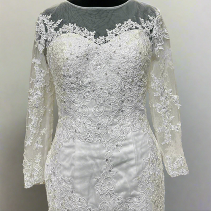 Sophisticated Christian wedding gown with floral lace detailing, long illusion sleeves, and elegant mermaid shape