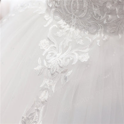 Timeless white Christian bridal gown with off-shoulder neckline and detailed lace craftsmanship