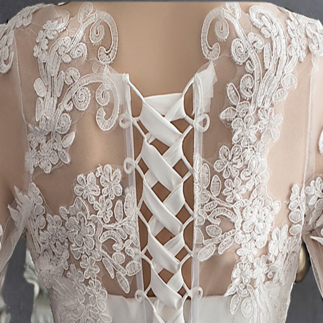 Timeless white Christian bridal gown with lace bodice, soft tulle skirt, and refined elegance