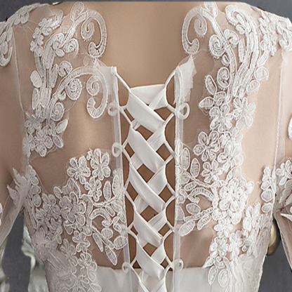 Timeless white Christian bridal gown with lace bodice, soft tulle skirt, and refined elegance
