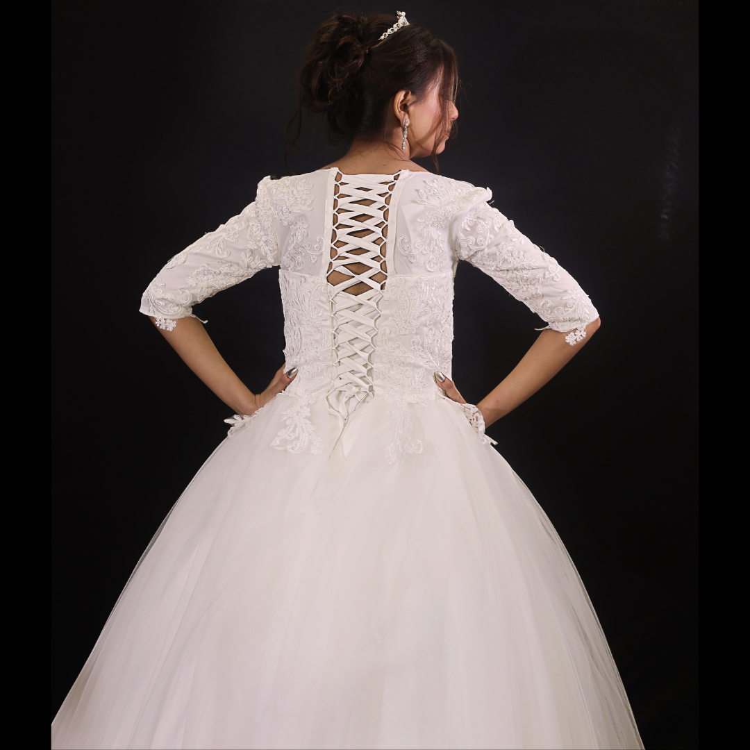 White Christian wedding ball gown with lace-trimmed hem and elegant embroidered bodice