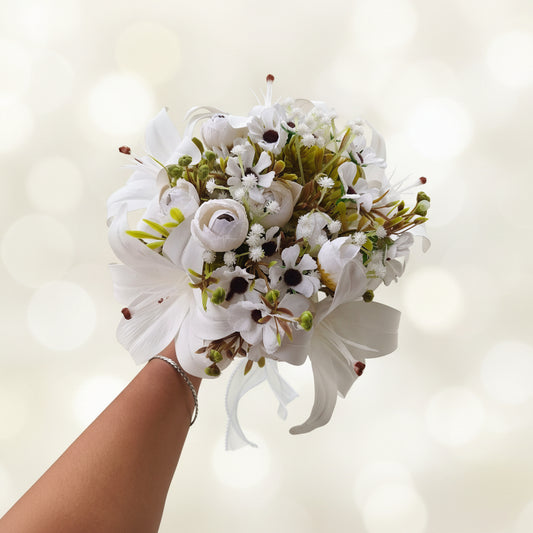 Close-up of flower arrangement in White Clutch Bridal Bouquet — GownLink B-138