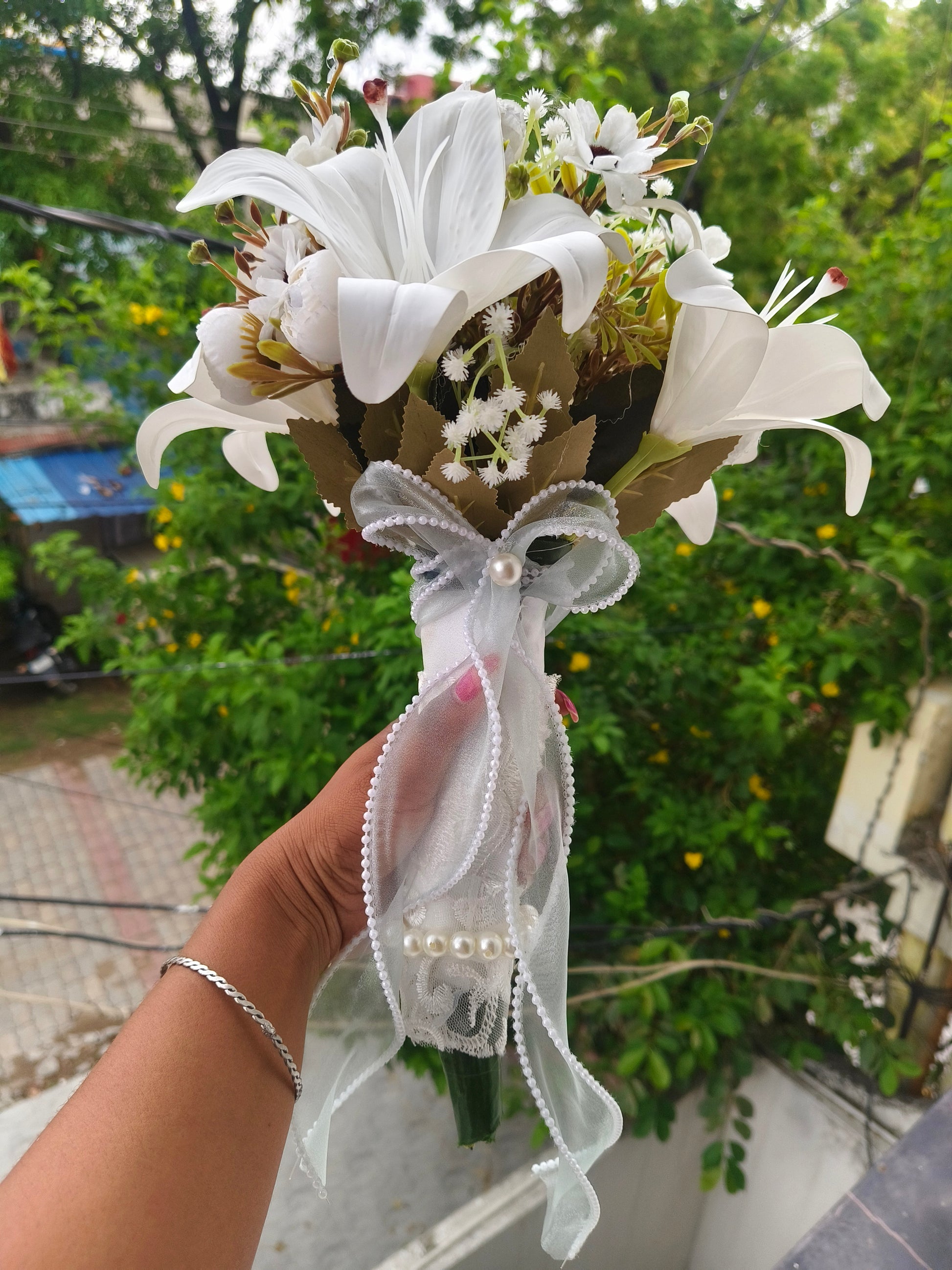 Close-up of flower arrangement in White Clutch Bridal Bouquet — GownLink B-138