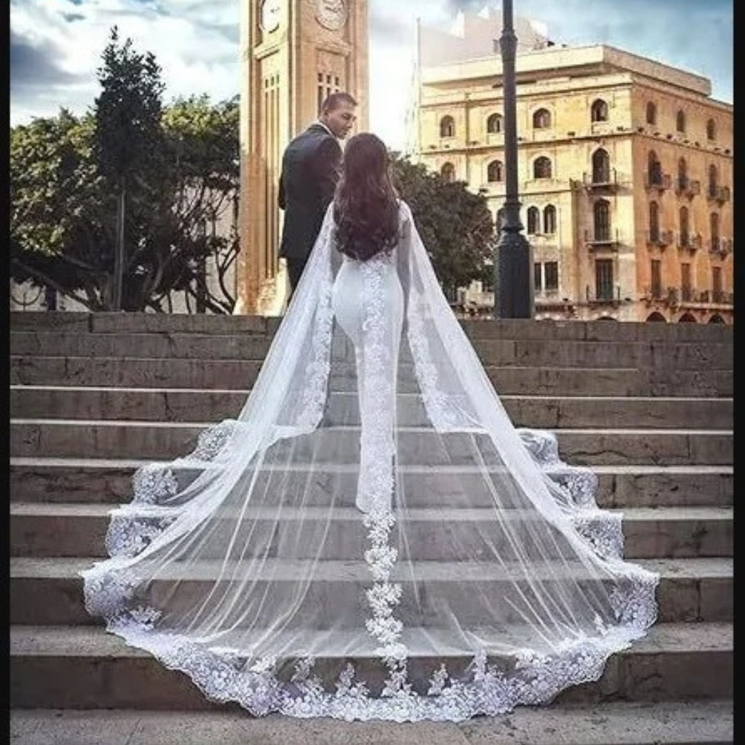 Soft tulle bridal cape with floral lace edging for Christian wedding dresses.