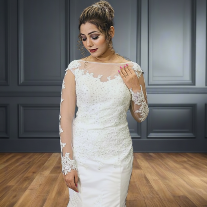 White lace mermaid wedding dress with illusion cap sleeves and elegant floral appliqué detailing