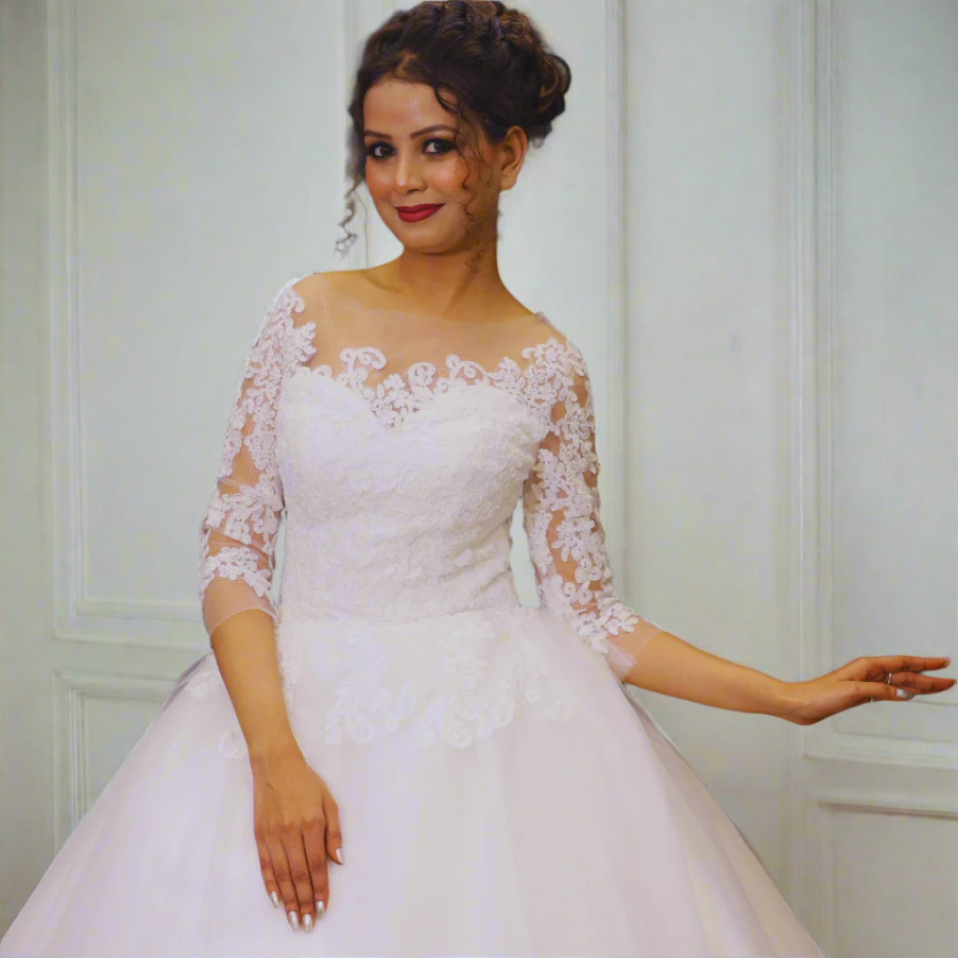 White lace princess bridal gown with illusion sleeves and delicate floral embroidery