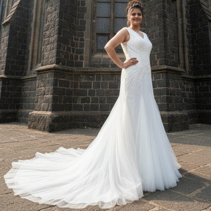 GownLink Christian wedding gown with elegant mermaid silhouette in front of a white church