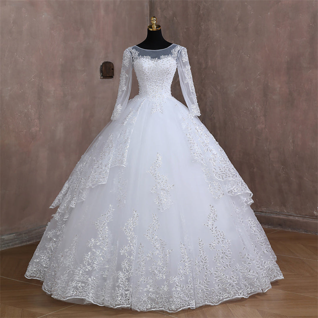 White Christian princess wedding gown with long illusion sleeves and intricate lace embroidery