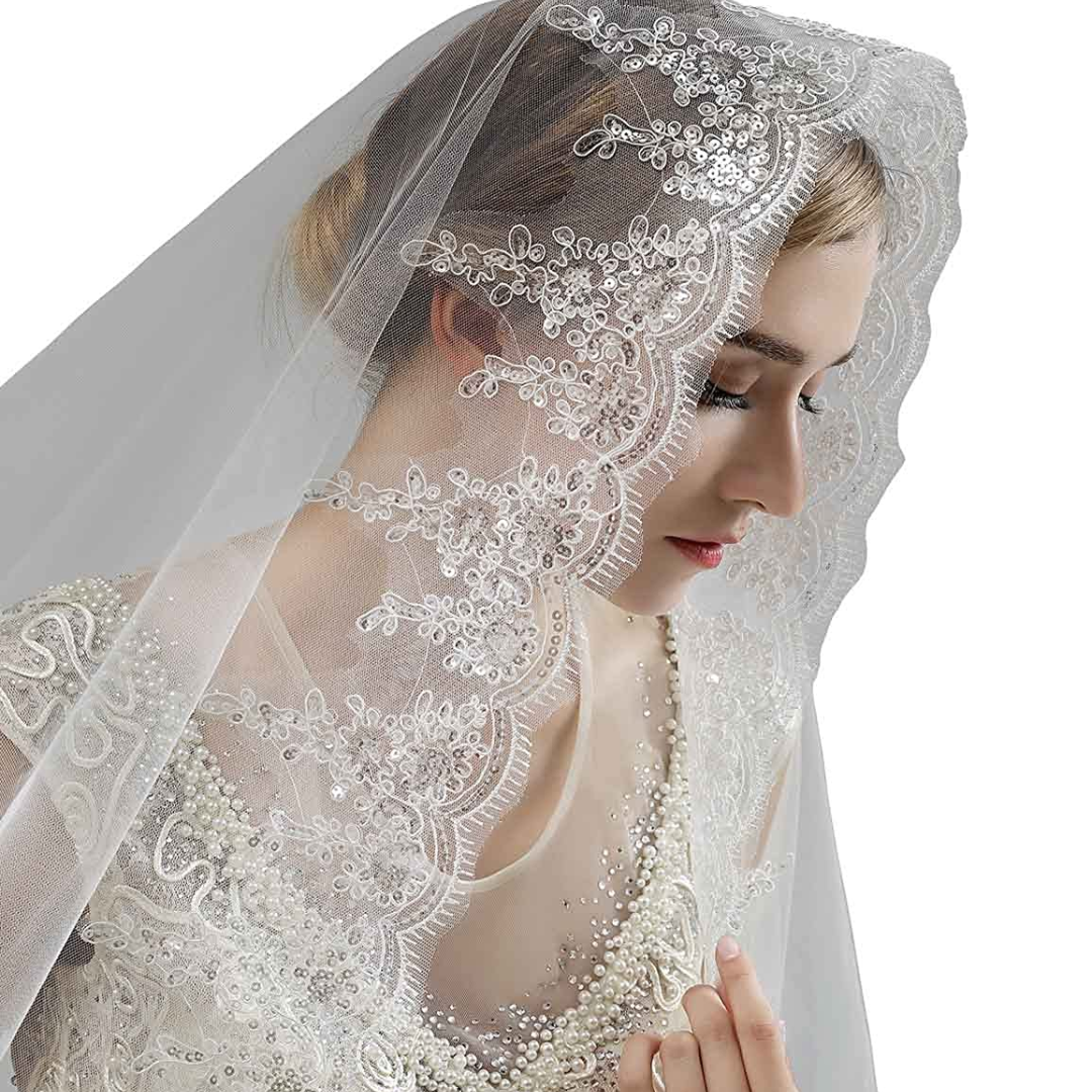Long white church wedding veil with delicate lace detailing