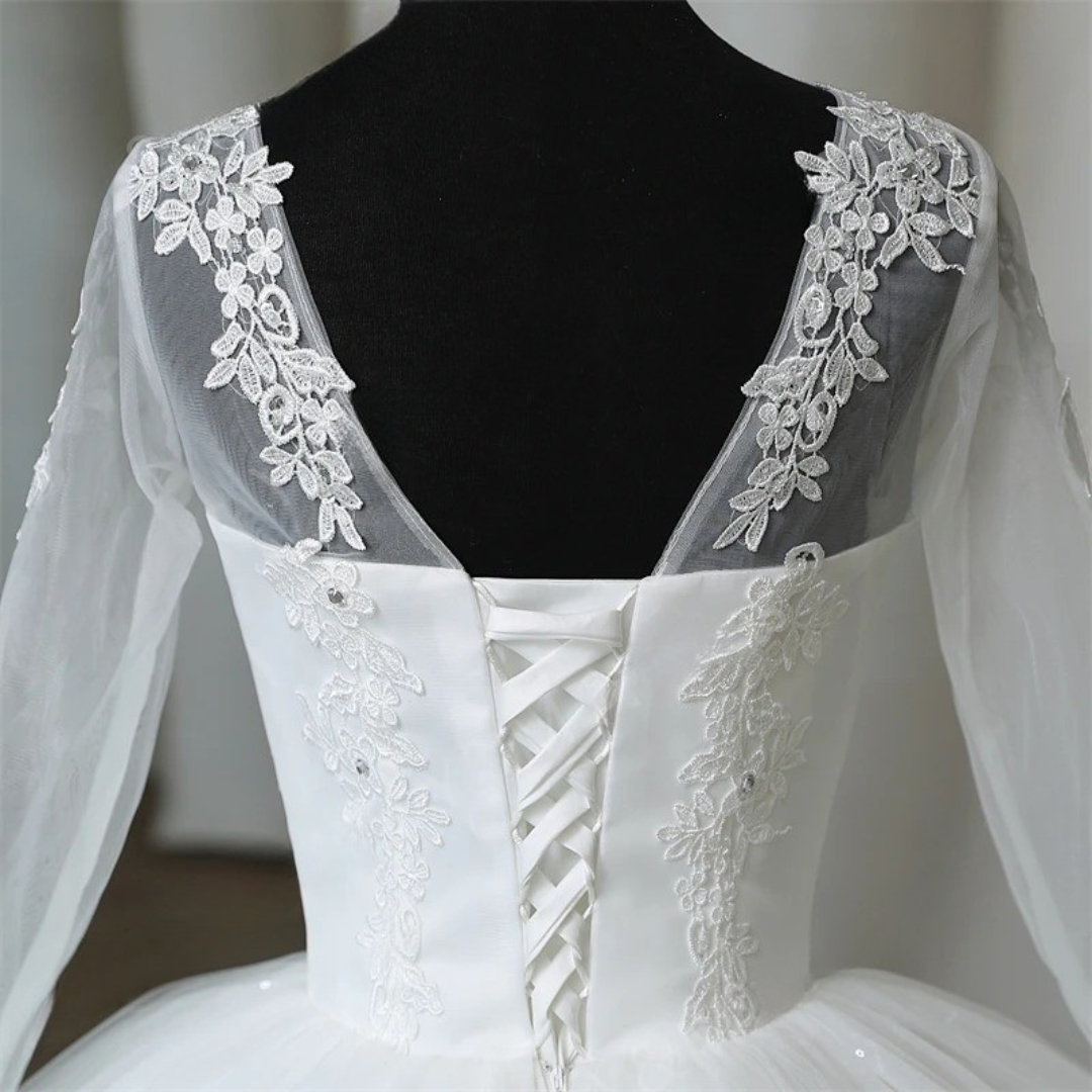 Full-length view of White Ball Gown with train spread on floor — GownLink GLHSD189CB