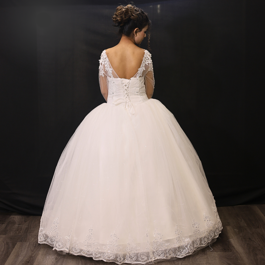 Modest Christian bridal ball gown with elegant lace sleeves and soft tulle