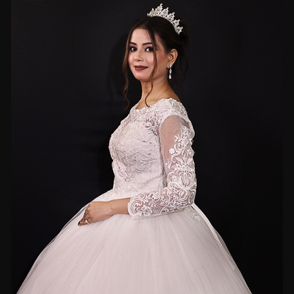 Modest Christian wedding dress with sheer lace sleeves and a flowing full-length bridal skirt

