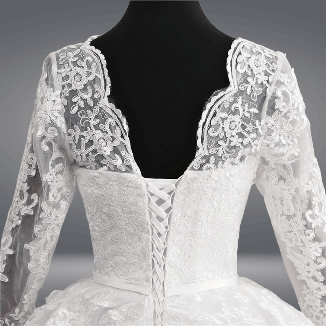 Modest white Christian bridal dress with full lace sleeves and premium craftsmanship for church weddings