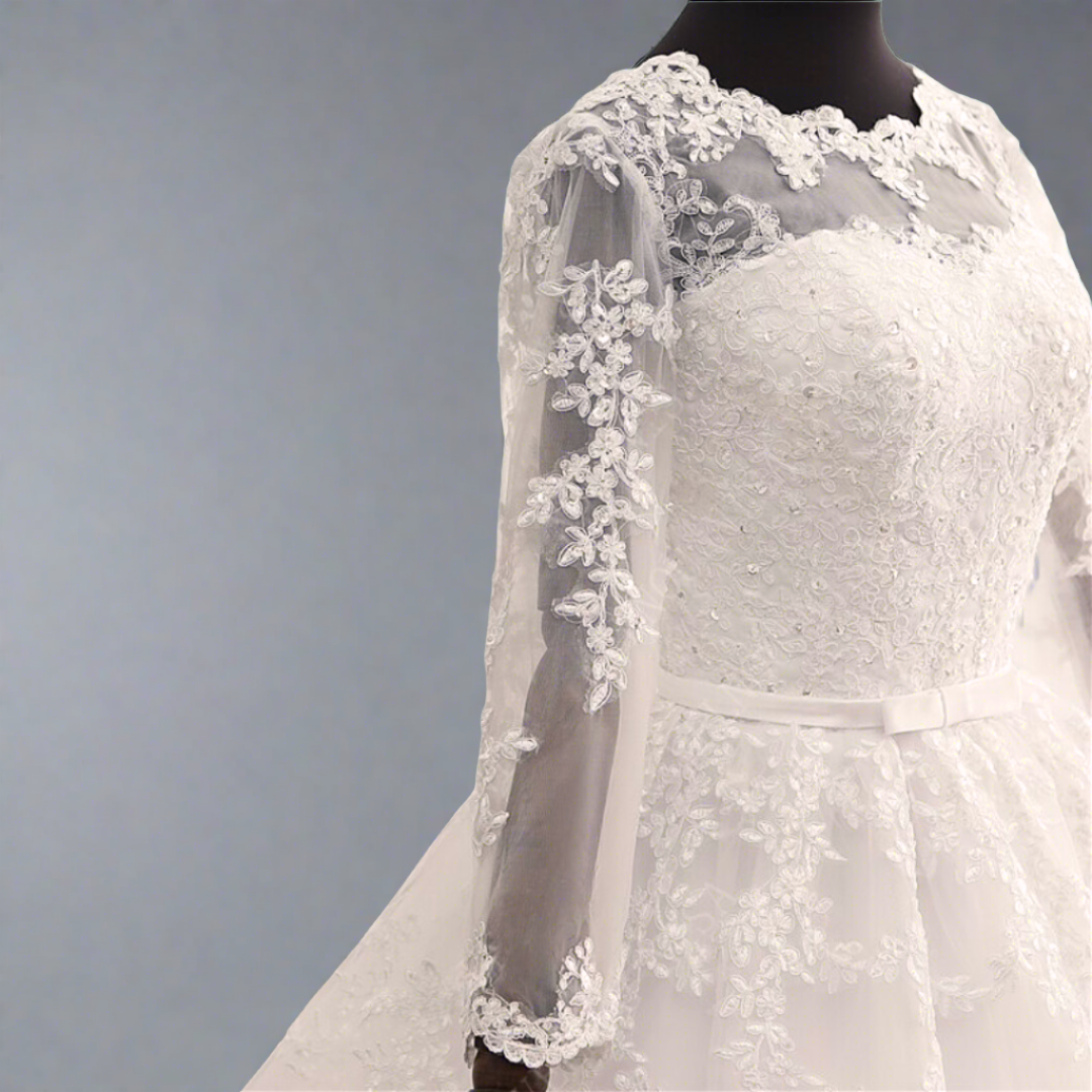 Princess-style lace wedding gown with a voluminous tulle skirt and timeless elegance