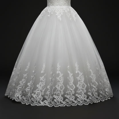 Timeless white princess wedding gown with floral lace border and cathedral-inspired elegance